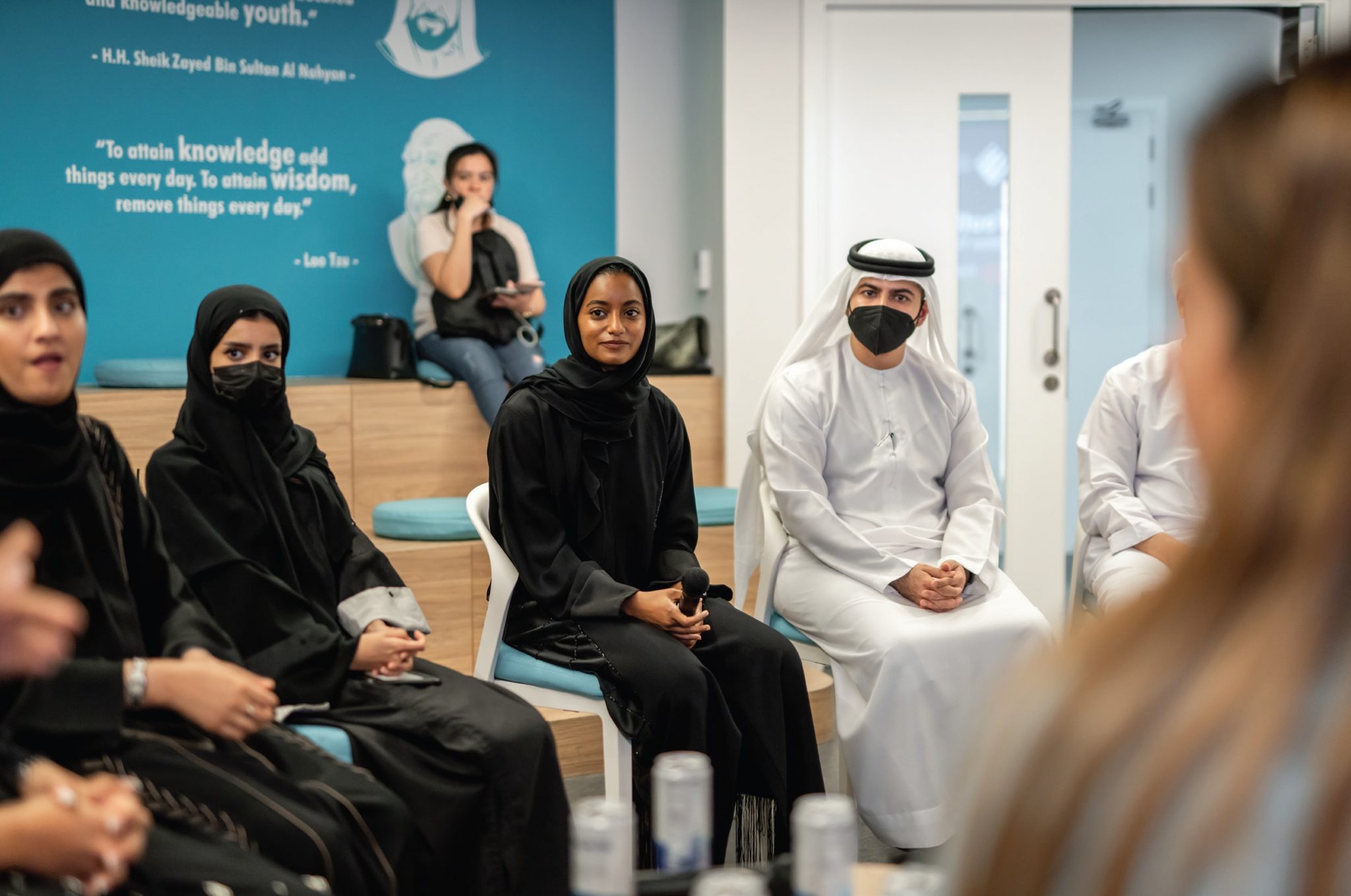 A group of Arab people sitting in a room engaged in a lively conversation - AGF's Thought Leadership Engagements