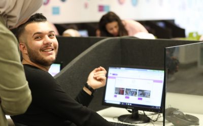 A Student smiles while doing virtual internship program on a computer. AGF'S pilot program collaborated with Virtual Internships.