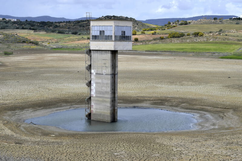 Above, the dry Chiba dam near the city of Korba in northeastern Tunisia on April 4, 2023. Tunisia’s dams are at critical lows following years of drought, exacerbated by pipeline leaks in a decrepit distribution network. (AFP)