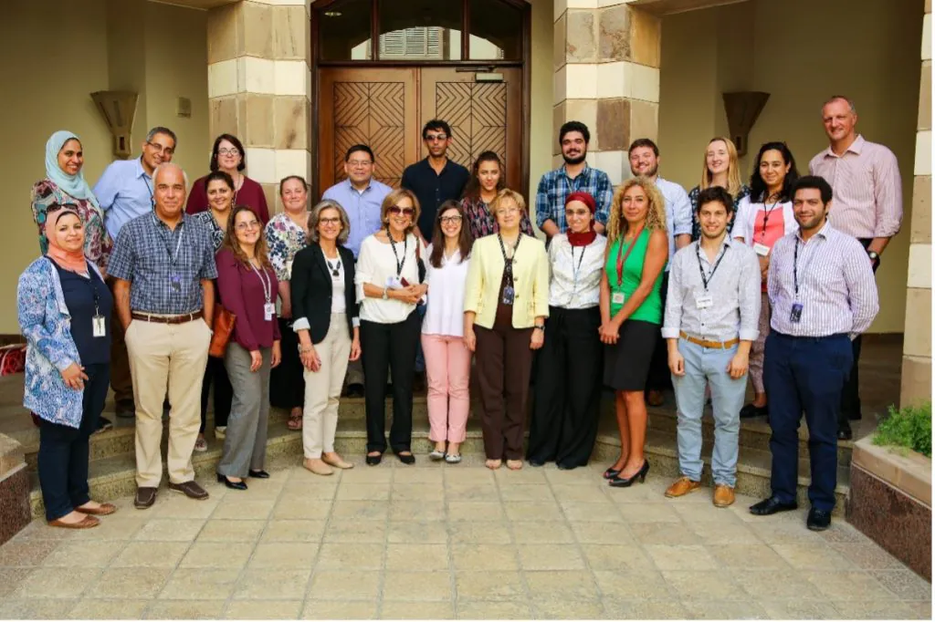 Group of people standing in front of a building entrance