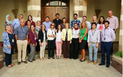 Group of people standing in front of a building entrance
