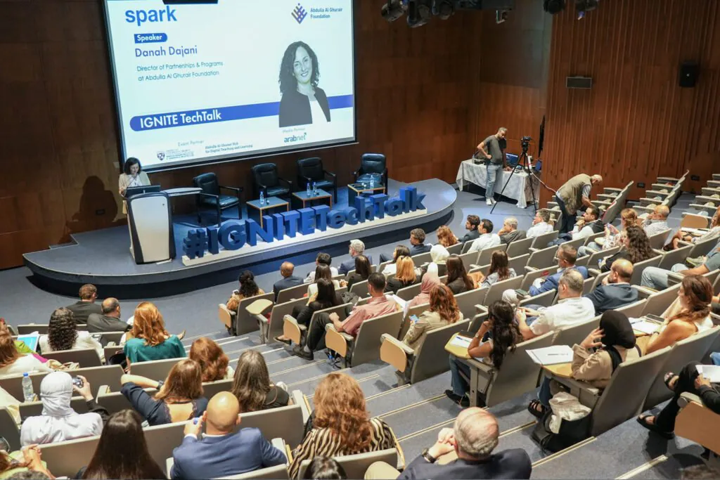 Academic presentation in an auditorium during IGNITE TechTalk