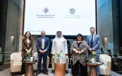 Five panelists in a formal setting, with a backdrop displaying logos of AGF and the UAE Ministry of Education.